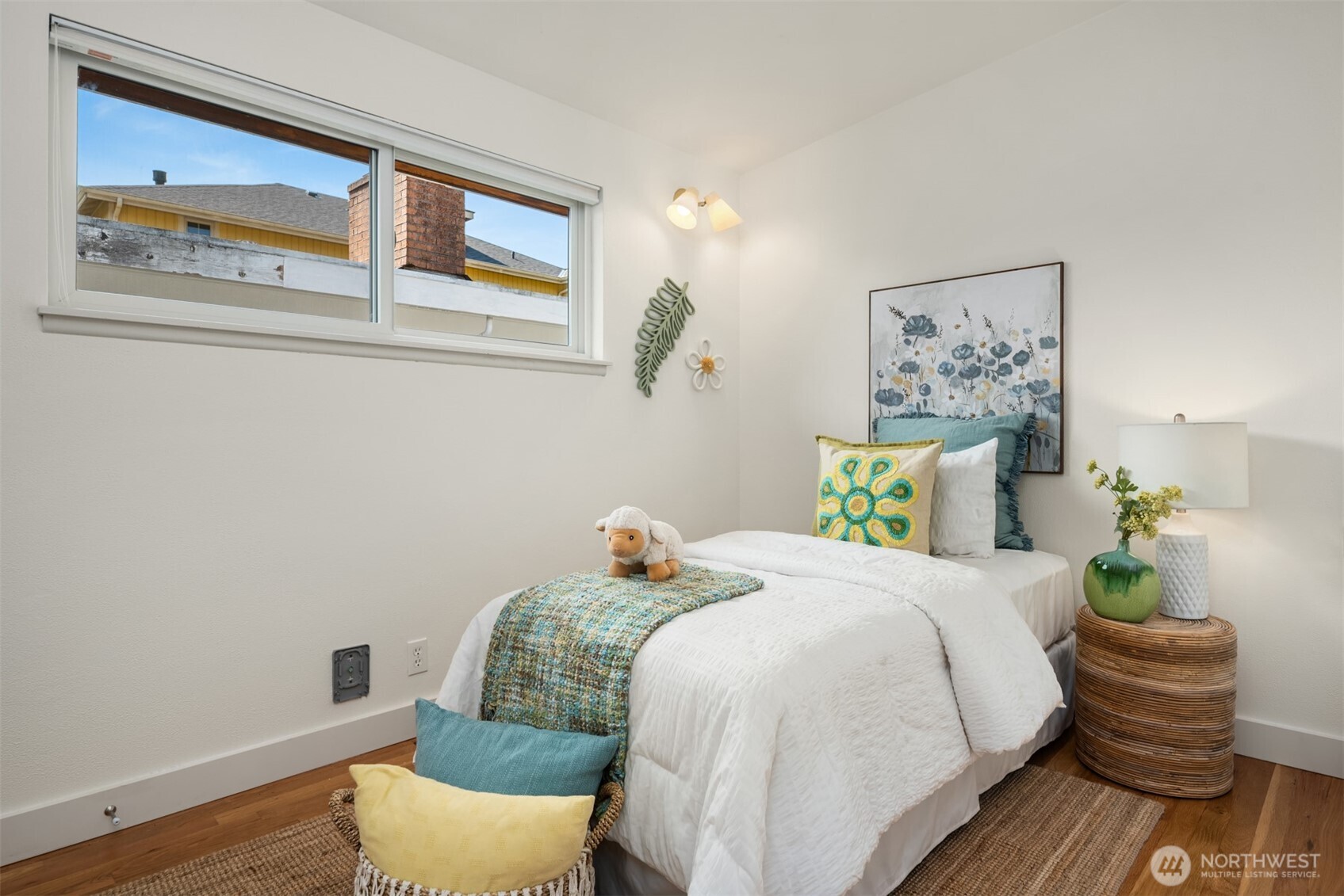4714 50th Avenue Southwest Seattle, WA 98116 - Photo 22 of 34 a bedroom with a bed and a painting on the wall