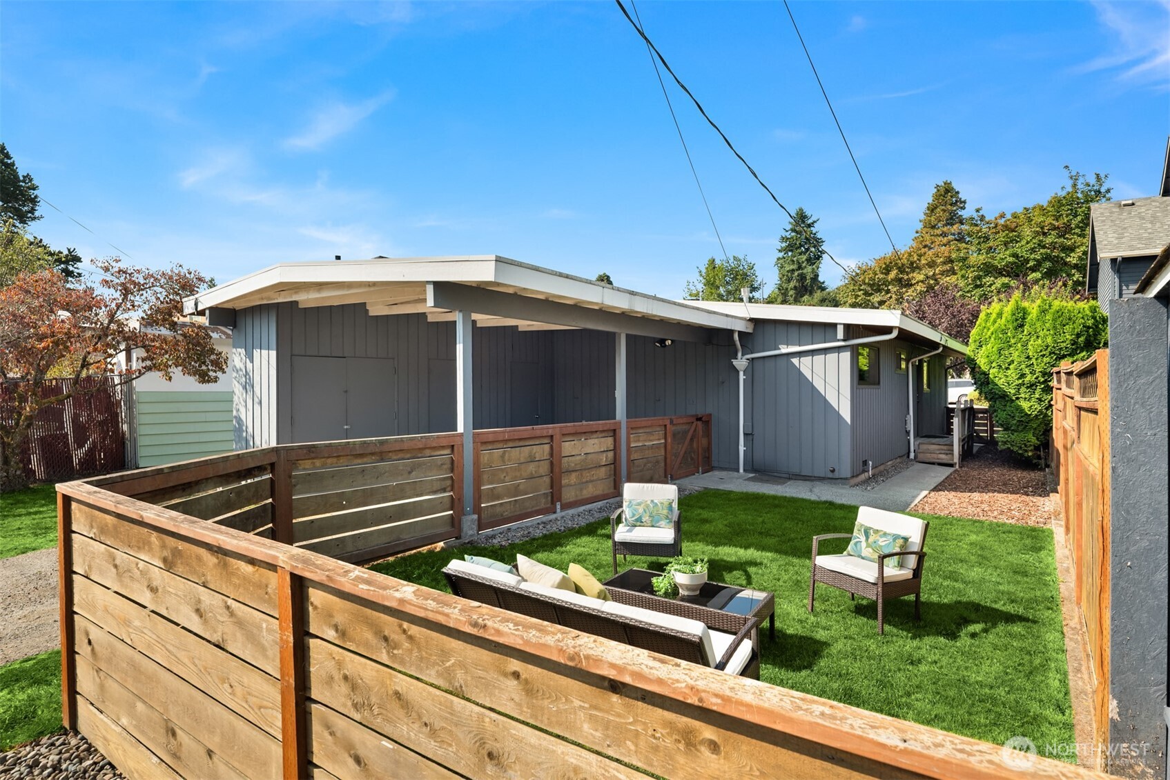 4714 50th Avenue Southwest Seattle, WA 98116 - Photo 25 of 34 a front view of house with yard outdoor seating and barbeque oven