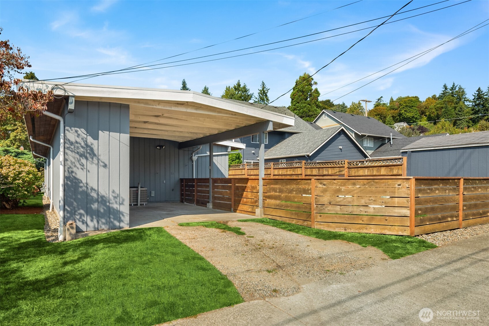 4714 50th Avenue Southwest Seattle, WA 98116 - Photo 26 of 34 a view of a house with a yard