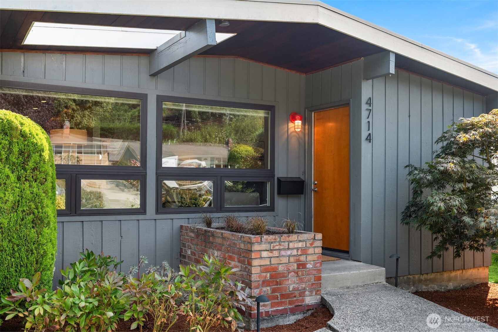 4714 50th Avenue Southwest Seattle, WA 98116 - Photo 3 of 34 a front view of a house with garden