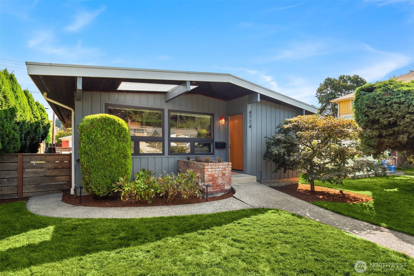 4714 50th Avenue Southwest Seattle, WA 98116 - Photo 33 of 34 a front view of a house with garden