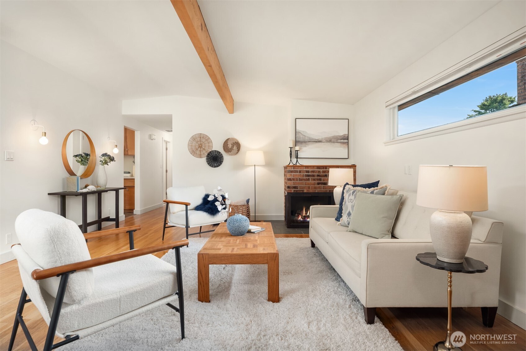 4714 50th Avenue Southwest Seattle, WA 98116 - Photo 6 of 34 a living room with furniture and a large mirror next to a window