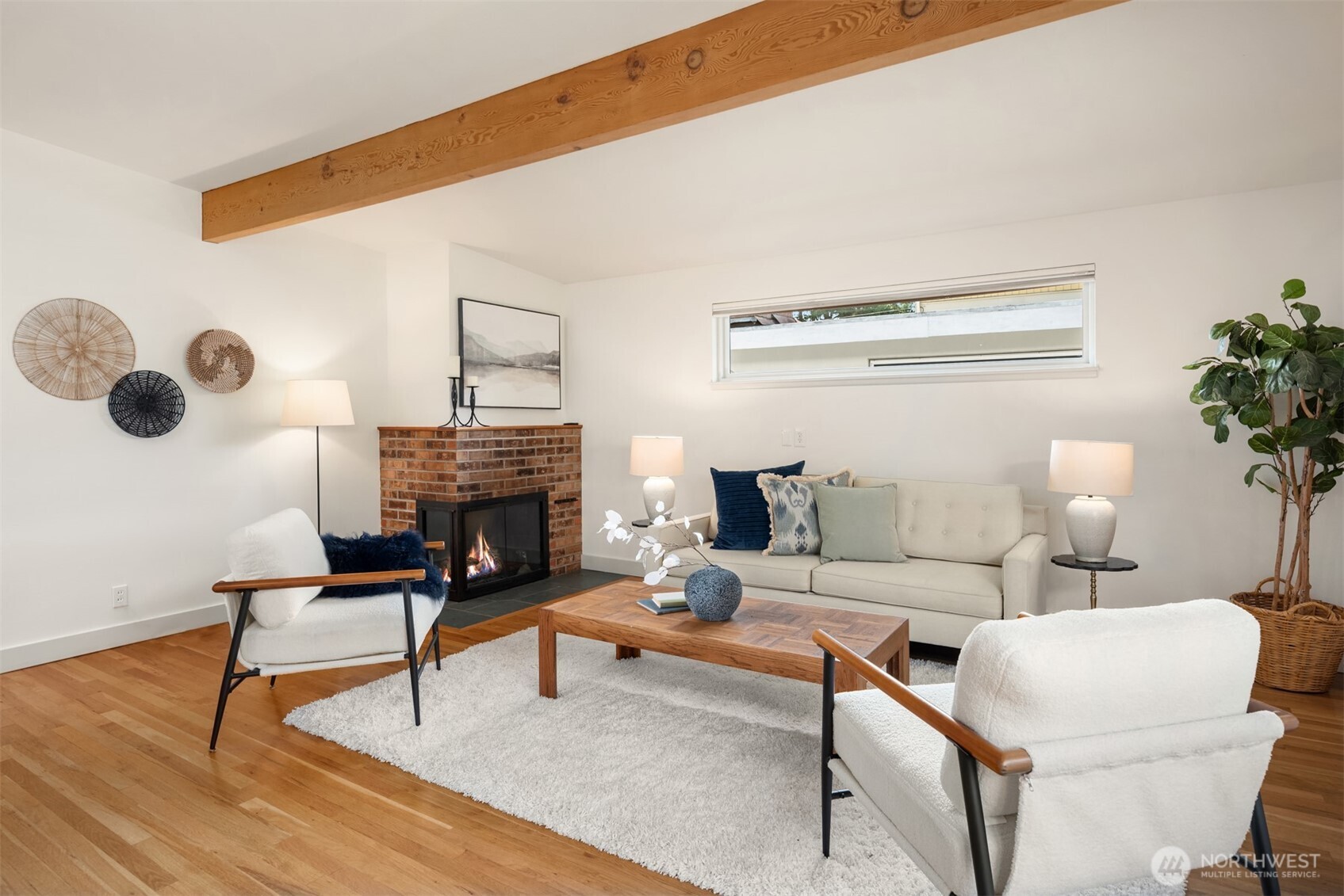 4714 50th Avenue Southwest Seattle, WA 98116 - Photo 7 of 34 a living room with furniture and a fireplace