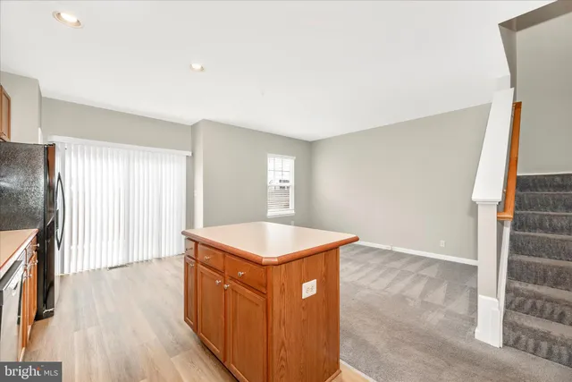 a view of a kitchen with a sink and cabinets