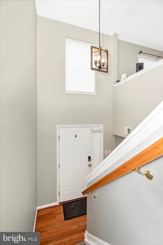 a living room with furniture and a wall painting