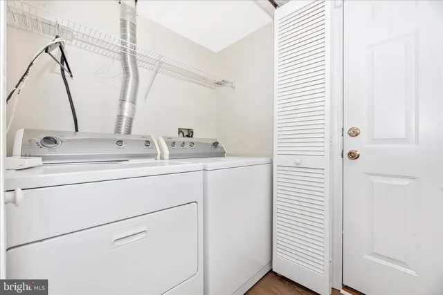 an aerial view of a house with a yard swimming pool and lake view