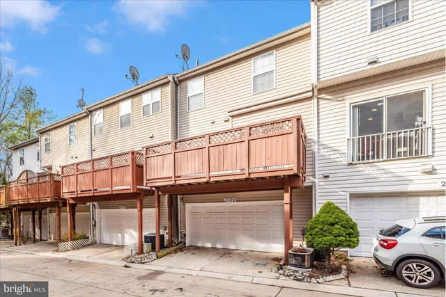 an aerial view of residential house with outdoor space and swimming pool