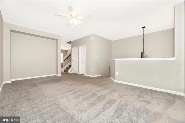 a kitchen with stainless steel appliances granite countertop a refrigerator a sink and a stove