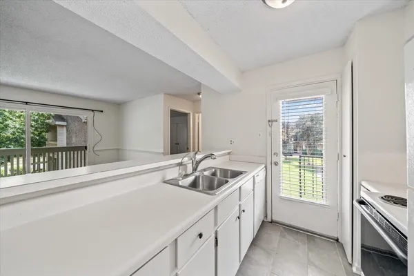 a bathroom with a toilet sink vanity and mirror