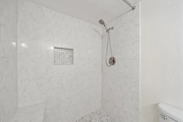 view of a house with swimming pool and sitting area