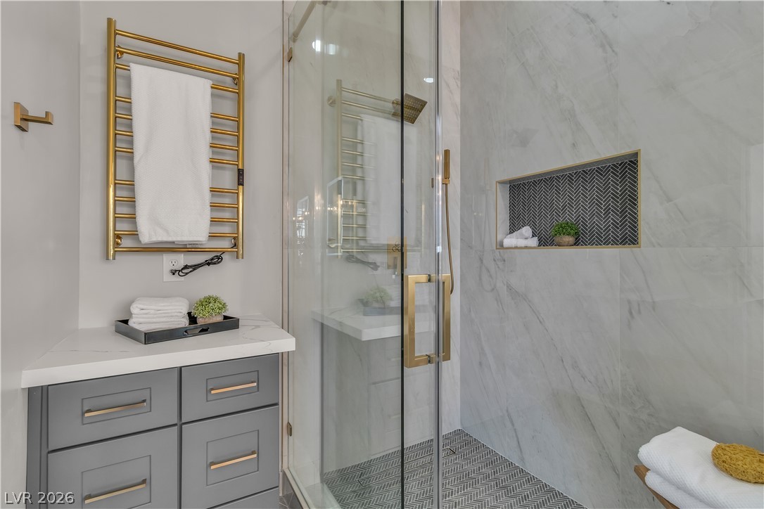 8848 Rainbow Ridge Drive Las Vegas, NV 89117 - Photo 36 of 43 A well-appointed shower space features elegant tile work and a convenient built-in niche.