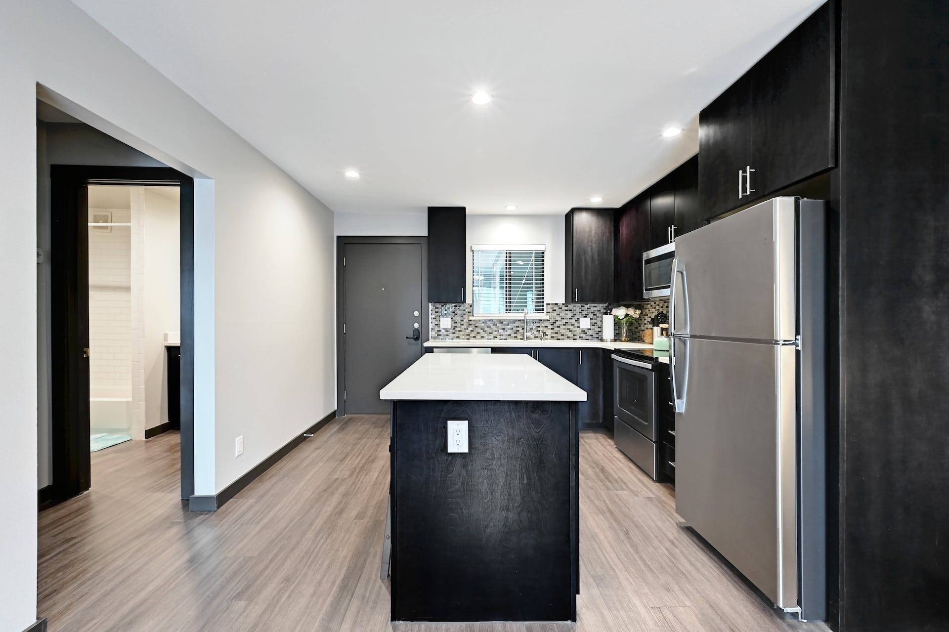 3301 Red River Street, Unit 303 Austin, TX 78705 - Photo 12 of 26 a kitchen with a refrigerator and a sink