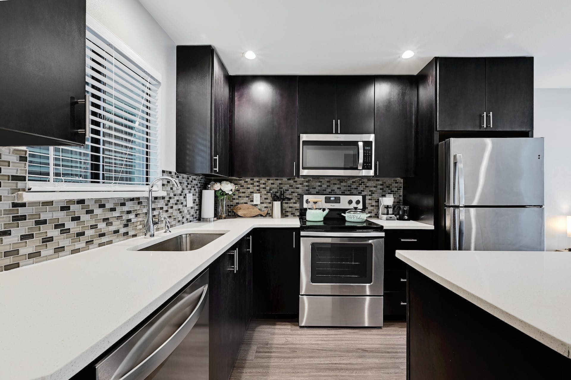 3301 Red River Street, Unit 303 Austin, TX 78705 - Photo 13 of 26 a kitchen with stainless steel appliances a sink stove and refrigerator