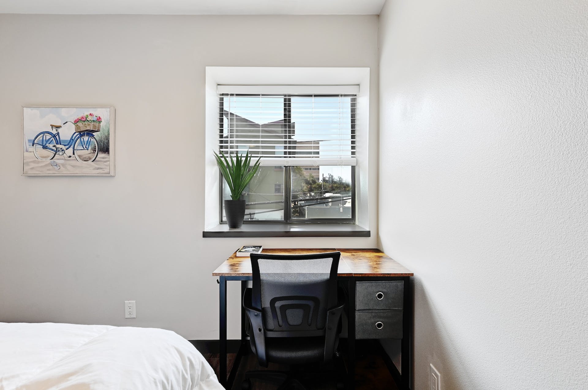 3301 Red River Street, Unit 303 Austin, TX 78705 - Photo 18 of 26 a bedroom with a bed and a window