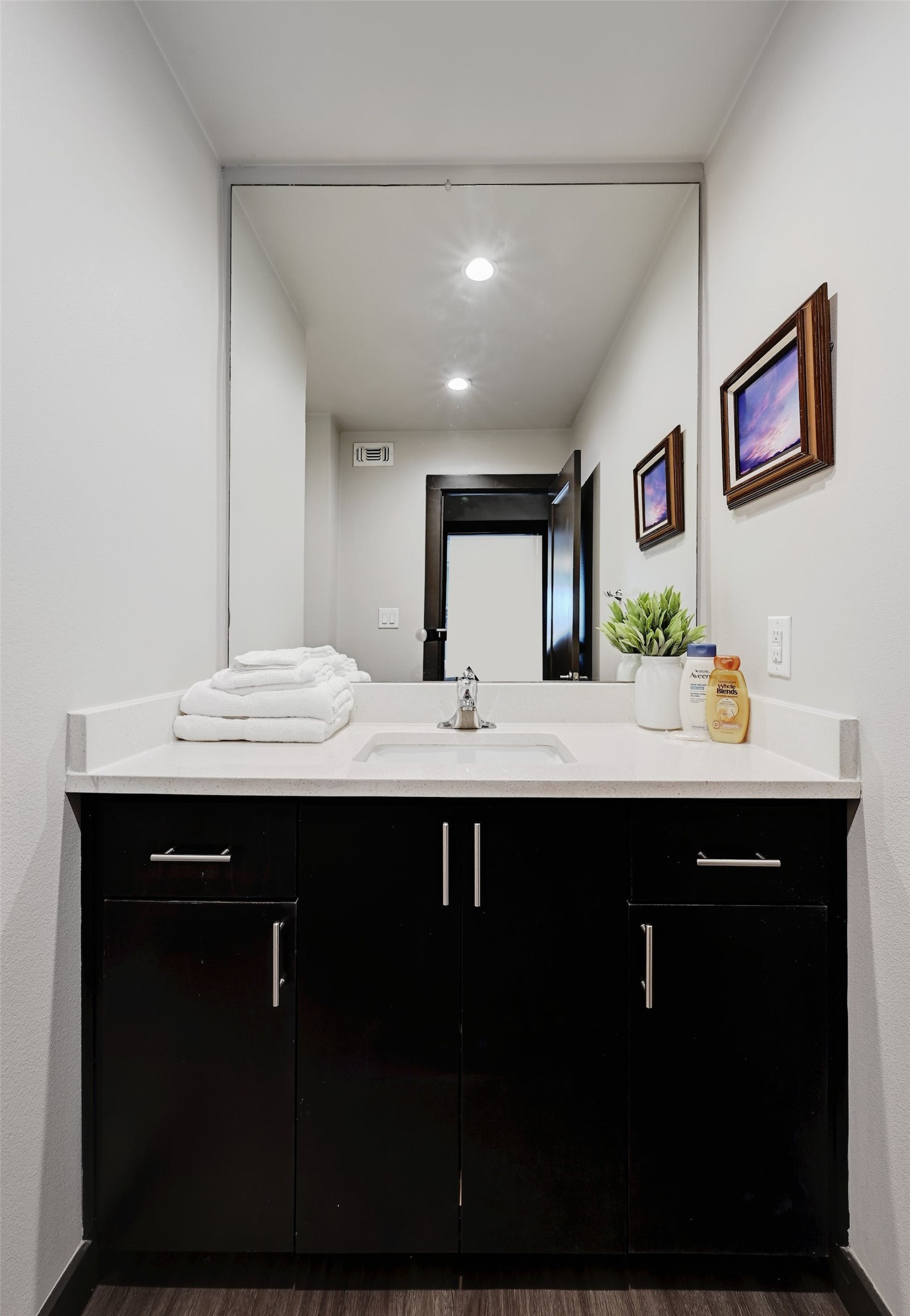 3301 Red River Street, Unit 303 Austin, TX 78705 - Photo 21 of 26 a bathroom with a sink and a mirror