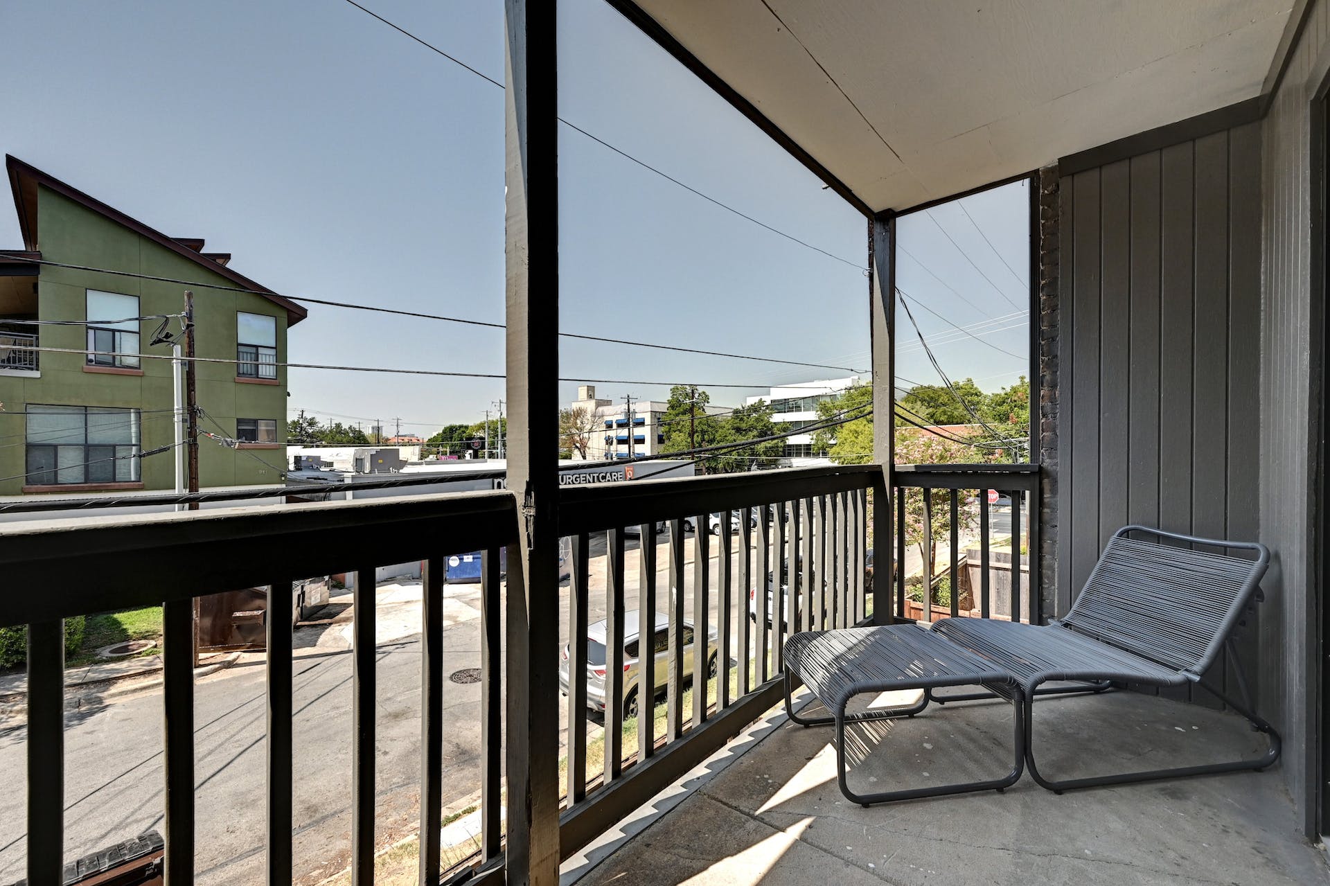 3301 Red River Street, Unit 303 Austin, TX 78705 - Photo 24 of 26 a view of a chair and tables in the balcony