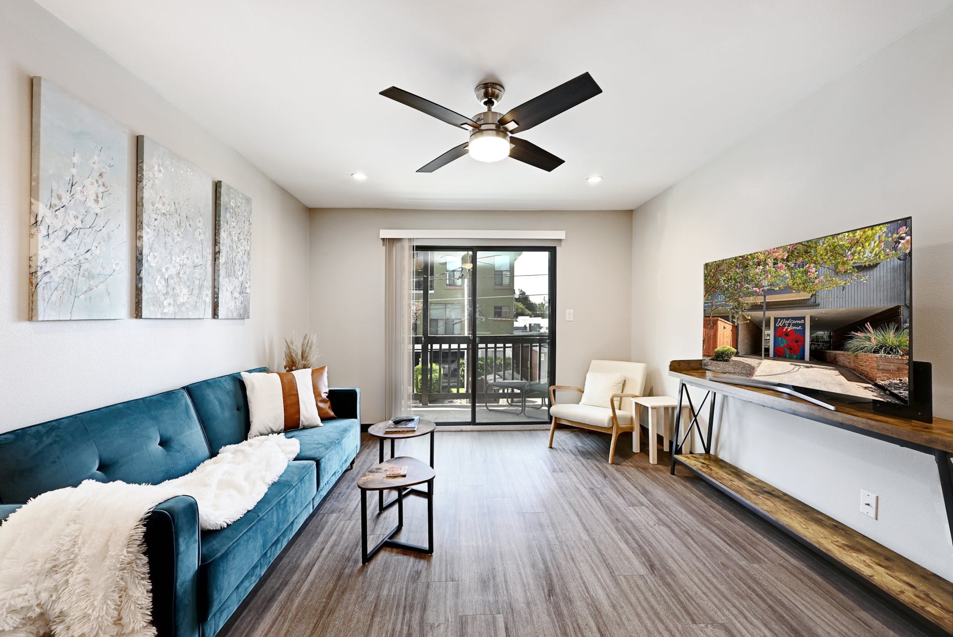 3301 Red River Street, Unit 303 Austin, TX 78705 - Photo 6 of 26 a living room with furniture and a large window