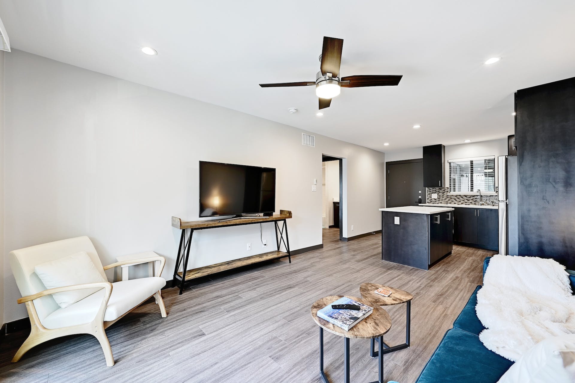 3301 Red River Street, Unit 303 Austin, TX 78705 - Photo 10 of 26 a living room with furniture and a flat screen tv
