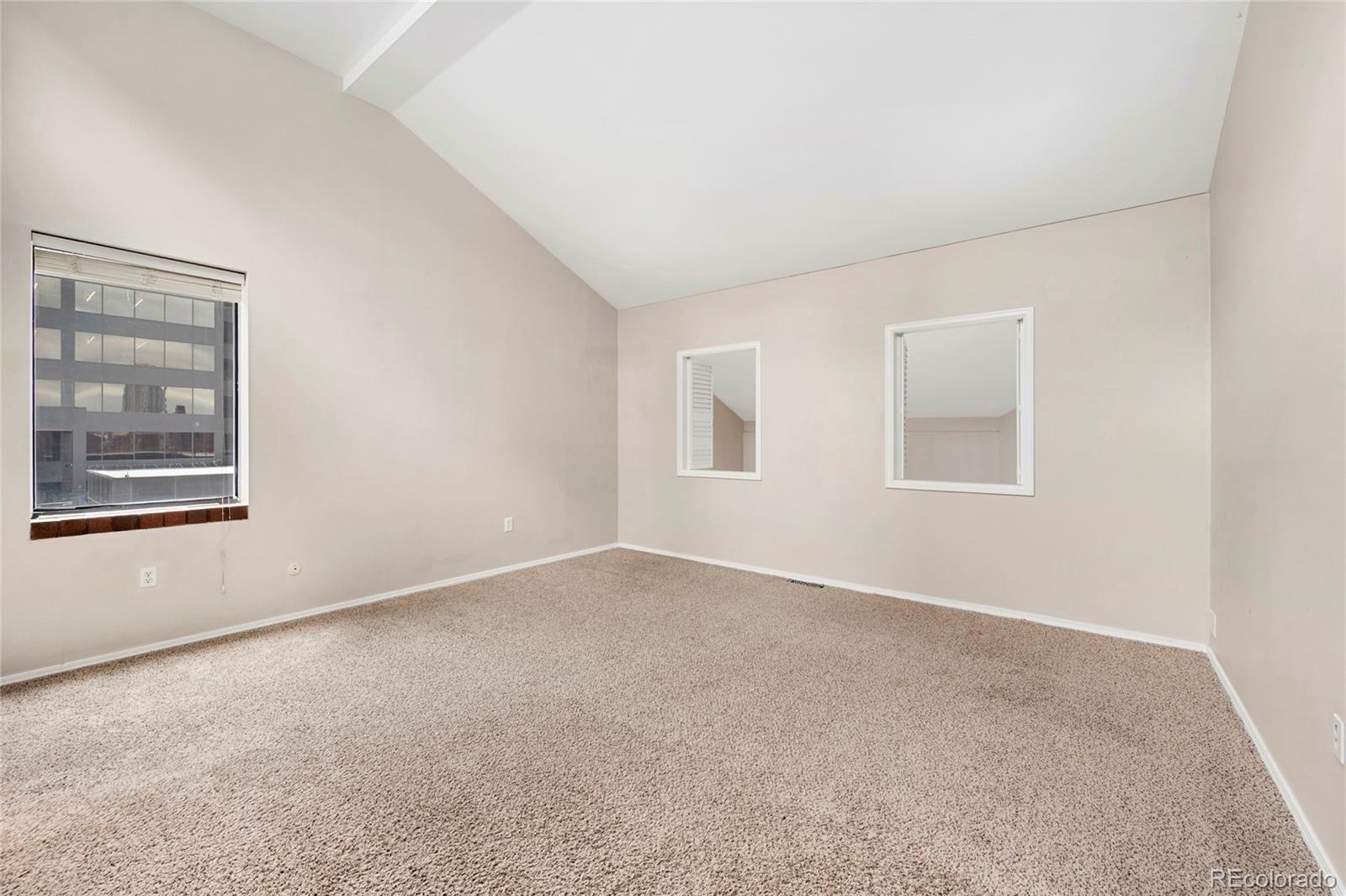 1512 Larimer Street, Unit 21 Denver, CO 80202 - Photo 12 of 18 an empty room with windows