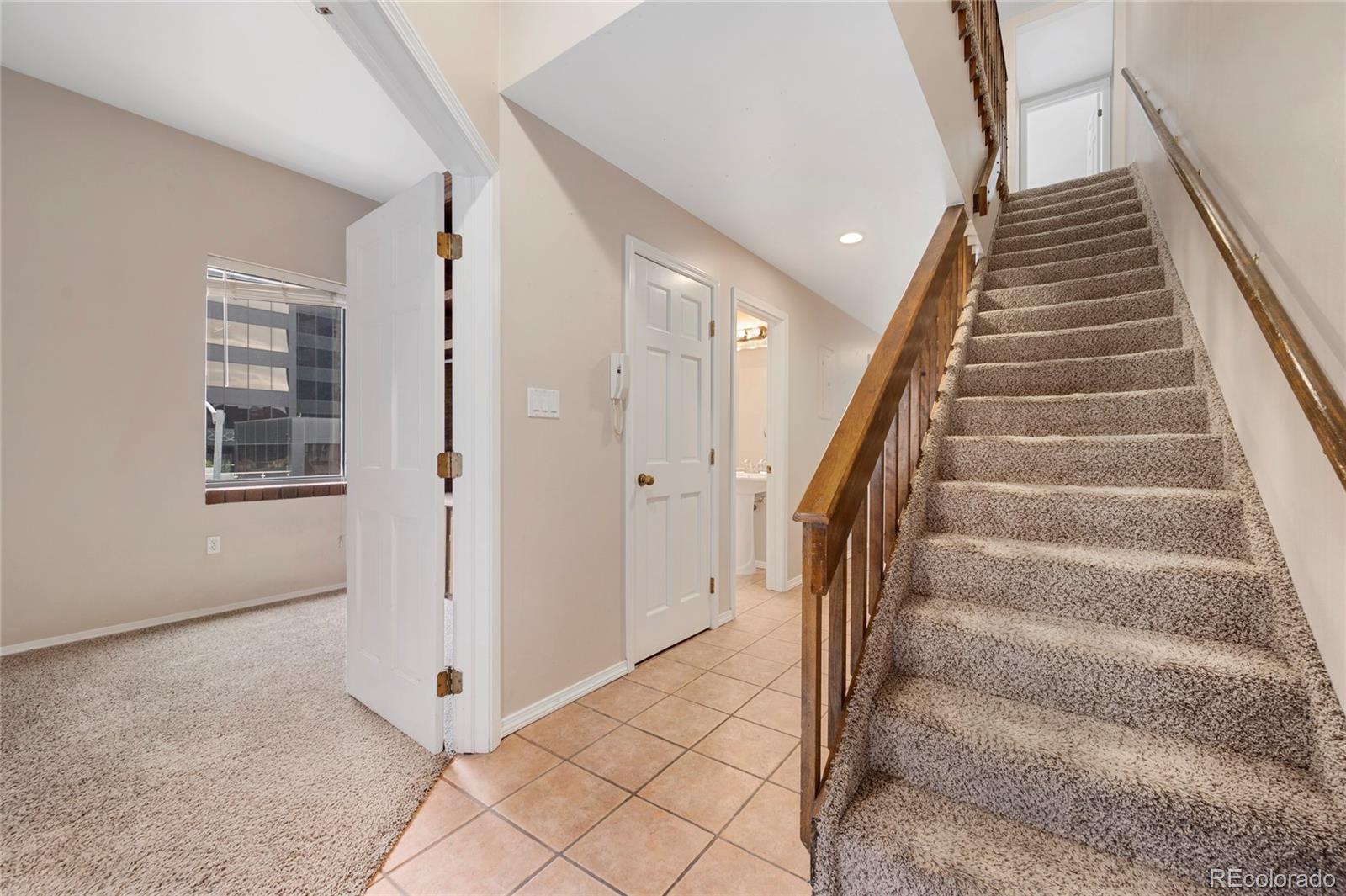 1512 Larimer Street, Unit 21 Denver, CO 80202 - Photo 17 of 18 a view of an entryway with staircase