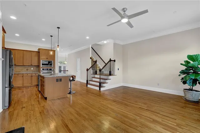 a view of kitchen with furniture and wooden floor