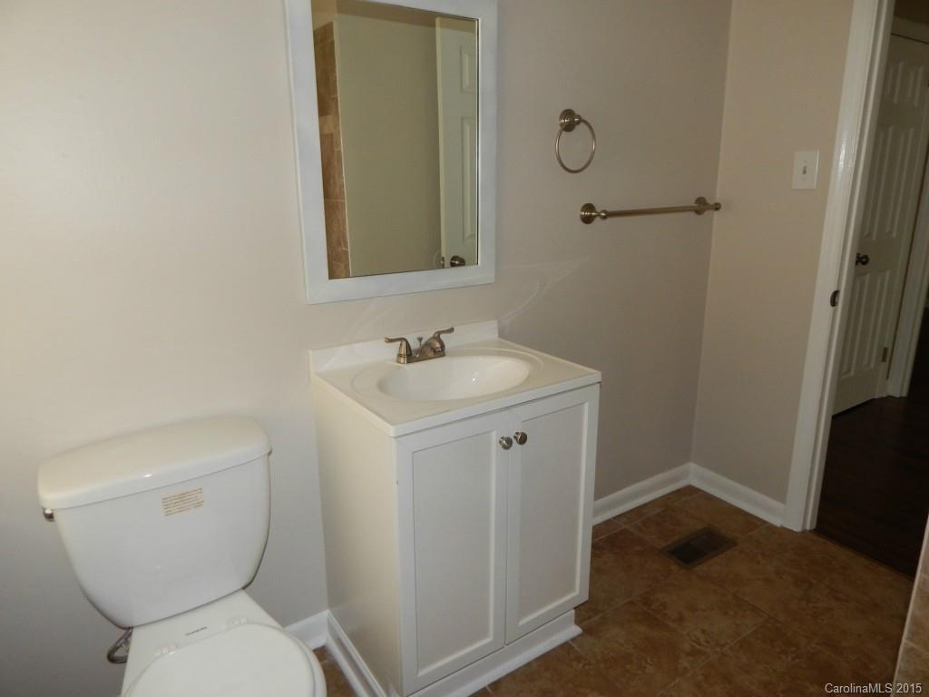 623 Fortune Street Charlotte, NC 28205 - Photo 12 of 15 a bathroom with a toilet sink and mirror