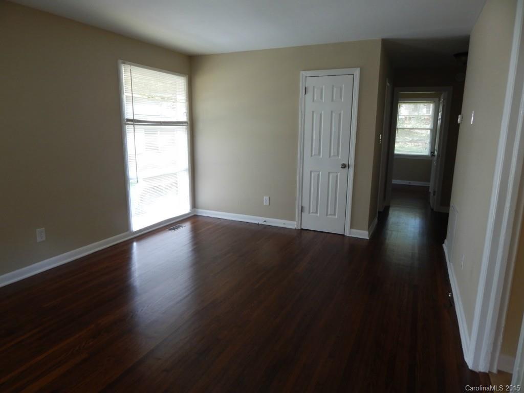 623 Fortune Street Charlotte, NC 28205 - Photo 5 of 15 an empty room with wooden floor and windows