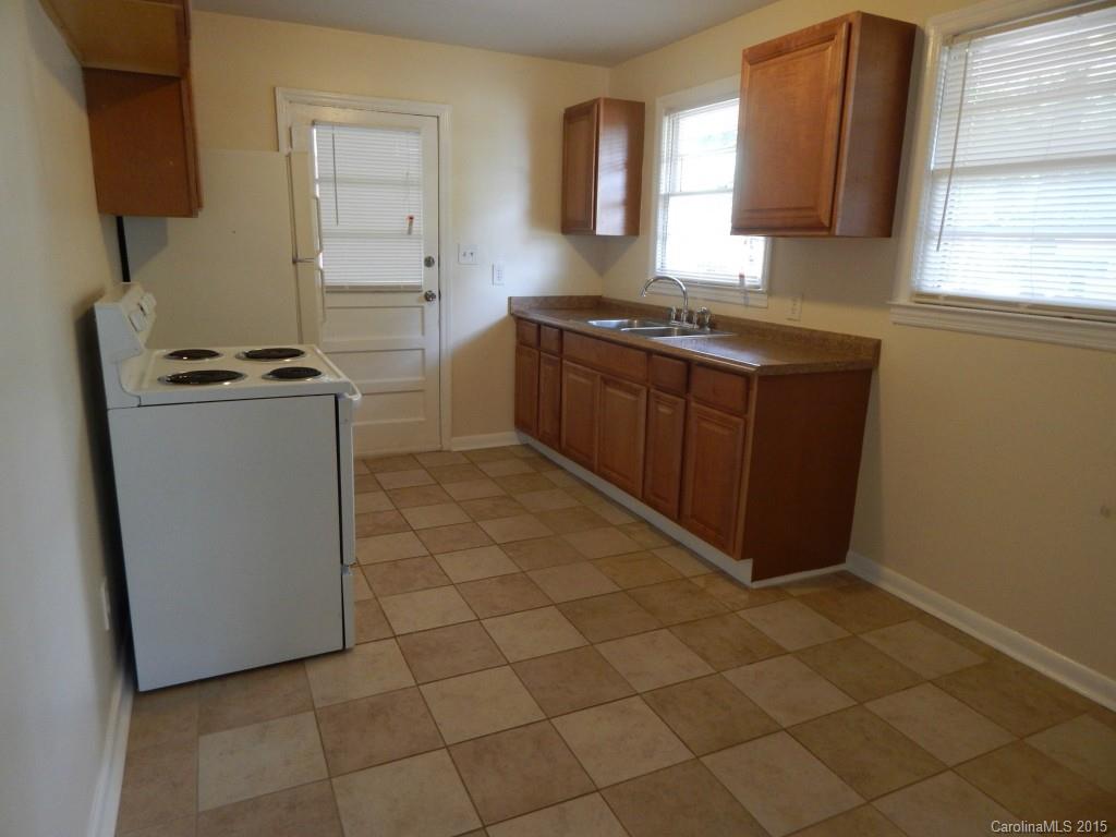 623 Fortune Street Charlotte, NC 28205 - Photo 6 of 15 a kitchen with stainless steel appliances a sink stove and a window