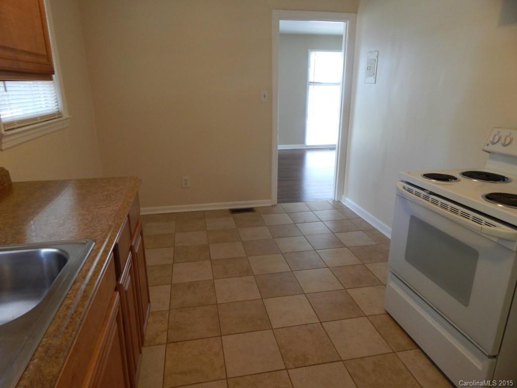 623 Fortune Street Charlotte, NC 28205 - Photo 7 of 15 a kitchen with a sink a stove and a microwave