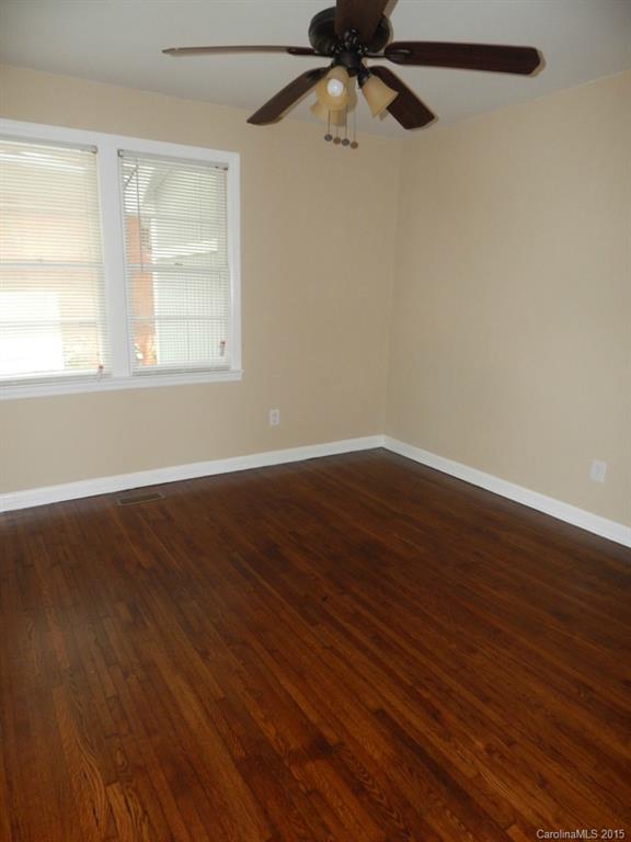 623 Fortune Street Charlotte, NC 28205 - Photo 8 of 15 wooden floor in an empty room with a window