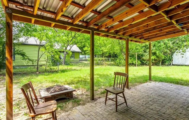 a view of yard with porch and outdoor seating