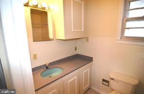 5377 Beta Place Indian Head, MD 20640 - Photo 9 of 13 a bathroom with a granite countertop sink and a toilet