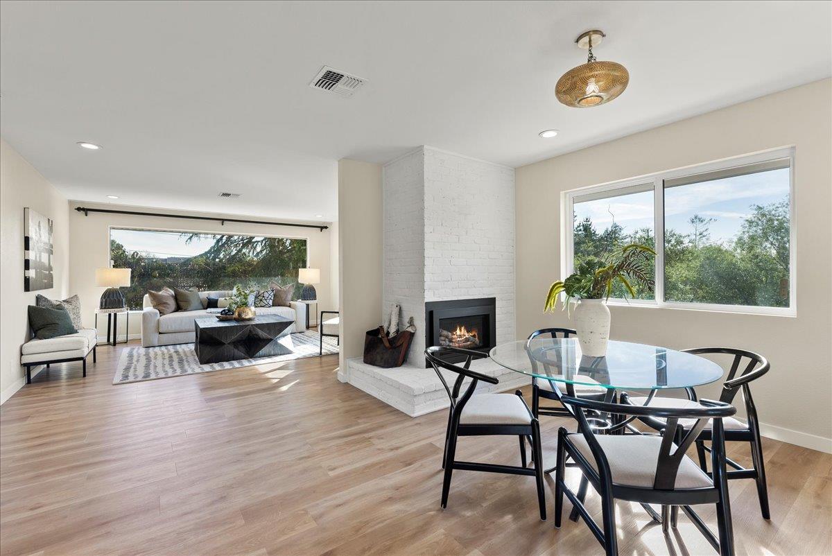 3400 Haas Drive Aptos, CA 95003 - Photo 5 of 32 a living room with furniture a fireplace and a floor to ceiling window