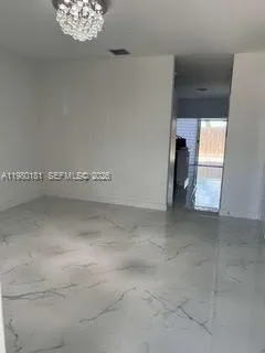 a bathroom with a granite countertop toilet and a sink