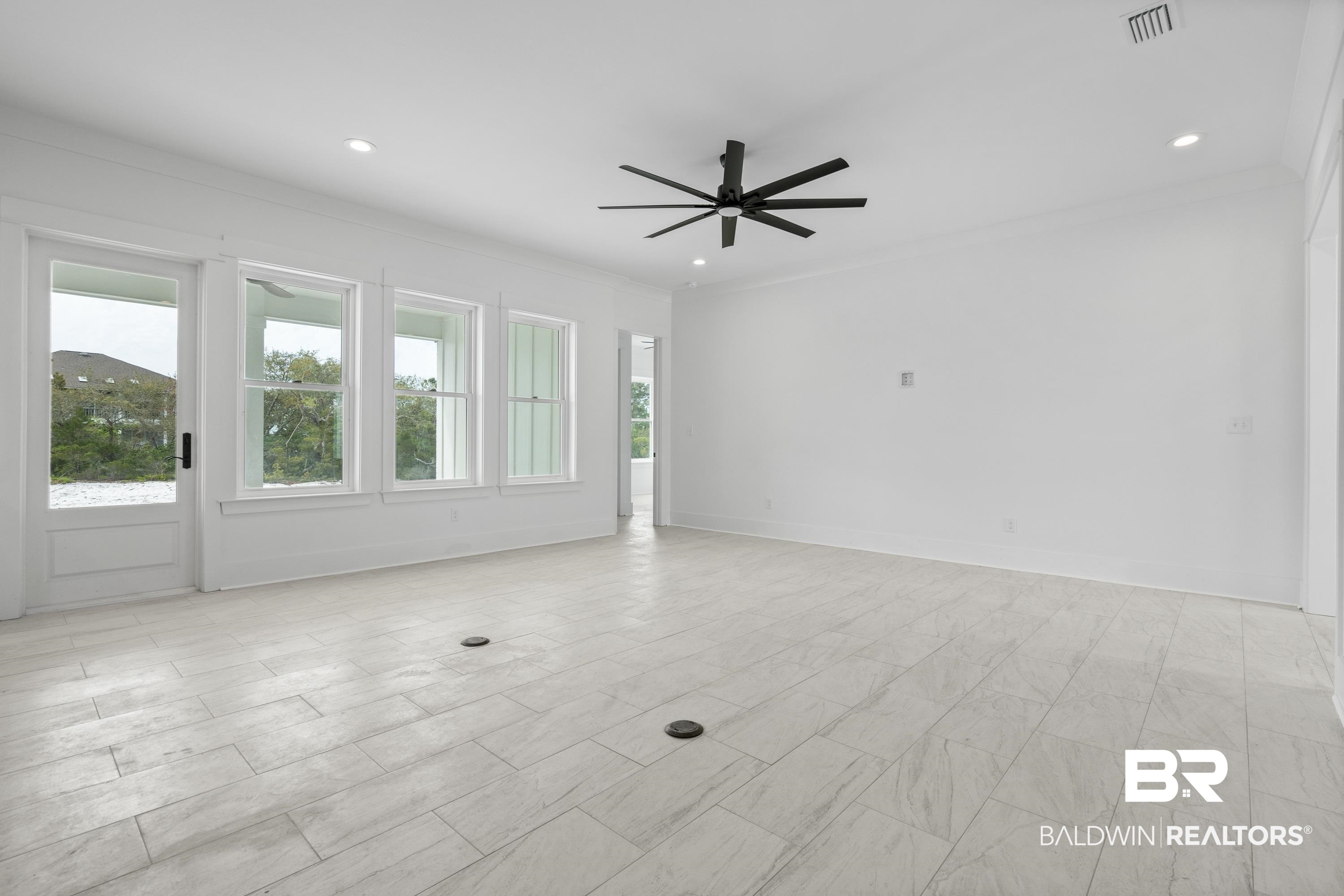 30650 Ono N Loop West Orange Beach, AL 36561 - Photo 7 of 38 Spare room featuring ceiling fan, crown molding, and recessed lighting
