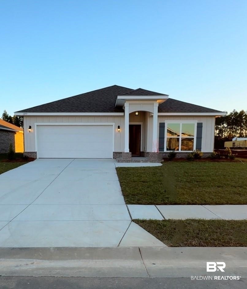 1255 Hayward Loop Foley, AL 36535 - Photo 1 of 27 Prairie-style home with a front yard and a garage