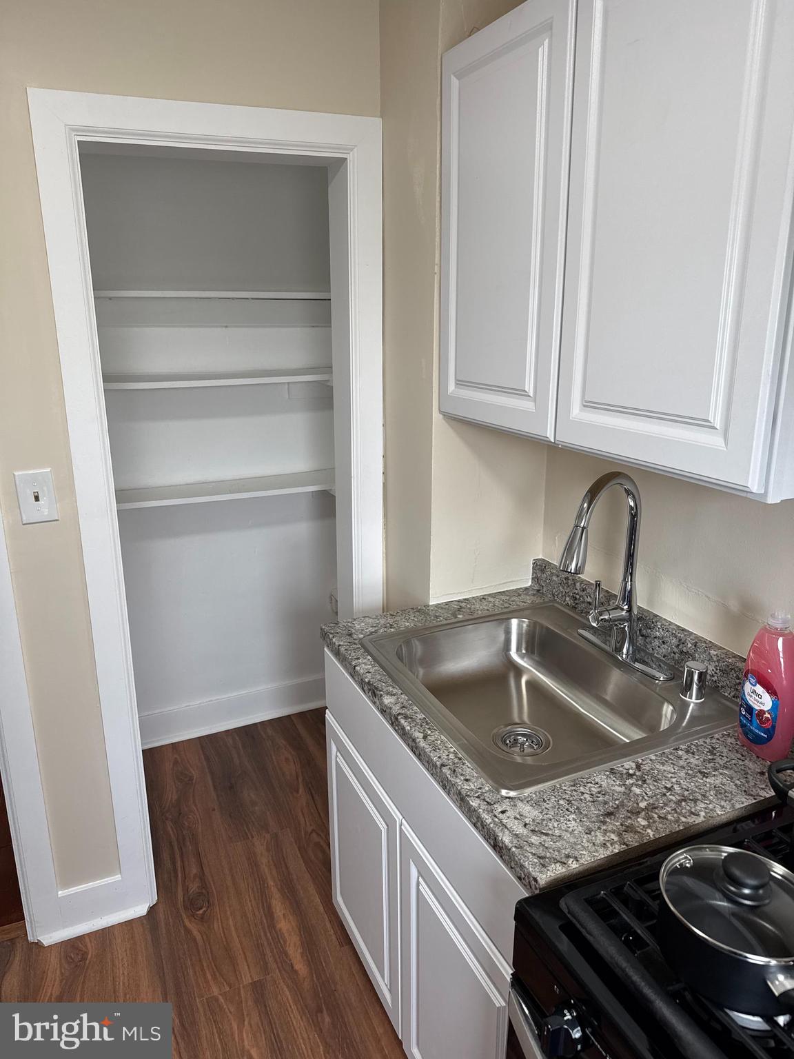 8529 Chestnut Oak Road, Unit 2 Parkville, MD 21234 - Photo 13 of 50 a kitchen with granite countertop a sink dishwasher stove and cabinets