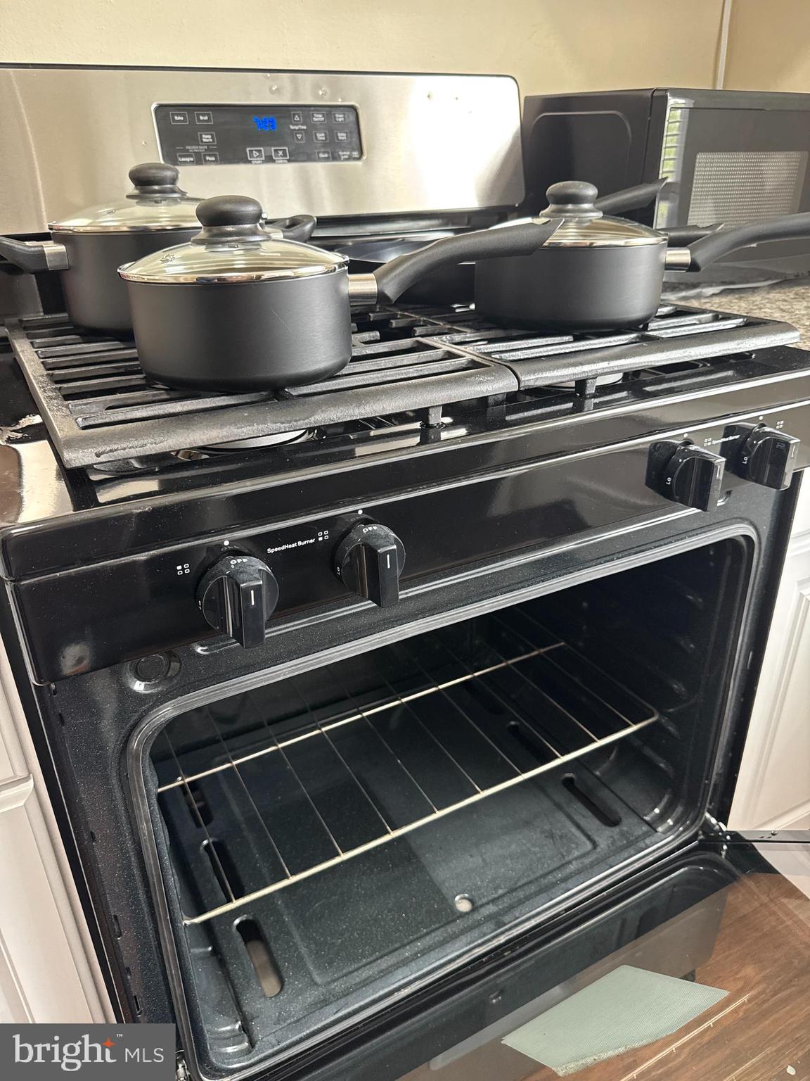 8529 Chestnut Oak Road, Unit 2 Parkville, MD 21234 - Photo 17 of 50 a stove top oven sitting inside of a kitchen