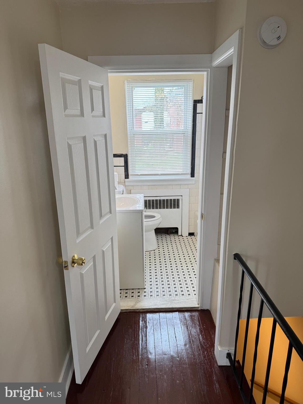 8529 Chestnut Oak Road, Unit 2 Parkville, MD 21234 - Photo 23 of 50 a view of a room with wooden floor and windows