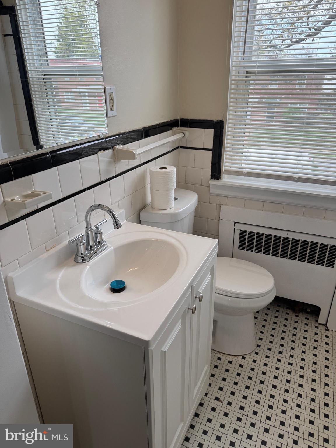 8529 Chestnut Oak Road, Unit 2 Parkville, MD 21234 - Photo 25 of 50 a bathroom with a sink and a toilet