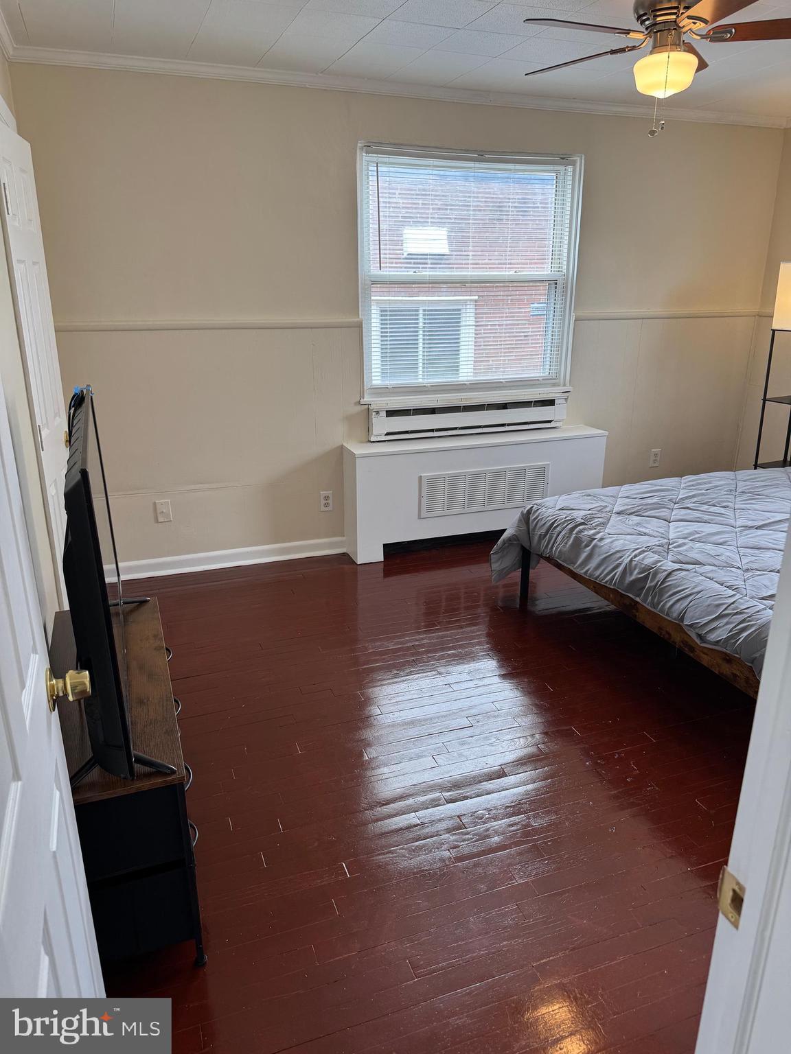 8529 Chestnut Oak Road, Unit 2 Parkville, MD 21234 - Photo 28 of 50 a bedroom with a bed and a window