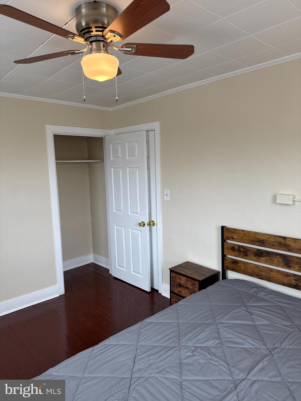 8529 Chestnut Oak Road, Unit 2 Parkville, MD 21234 - Photo 3 of 50 a bedroom with a bed and a chandelier