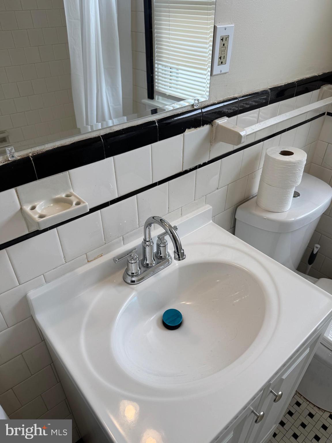 8529 Chestnut Oak Road, Unit 2 Parkville, MD 21234 - Photo 35 of 50 a bathroom with a sink and a mirror