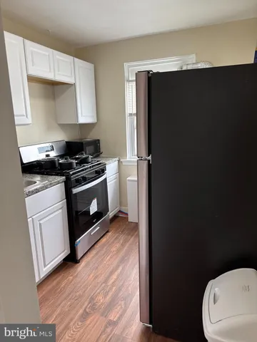 a kitchen with a sink and a stove