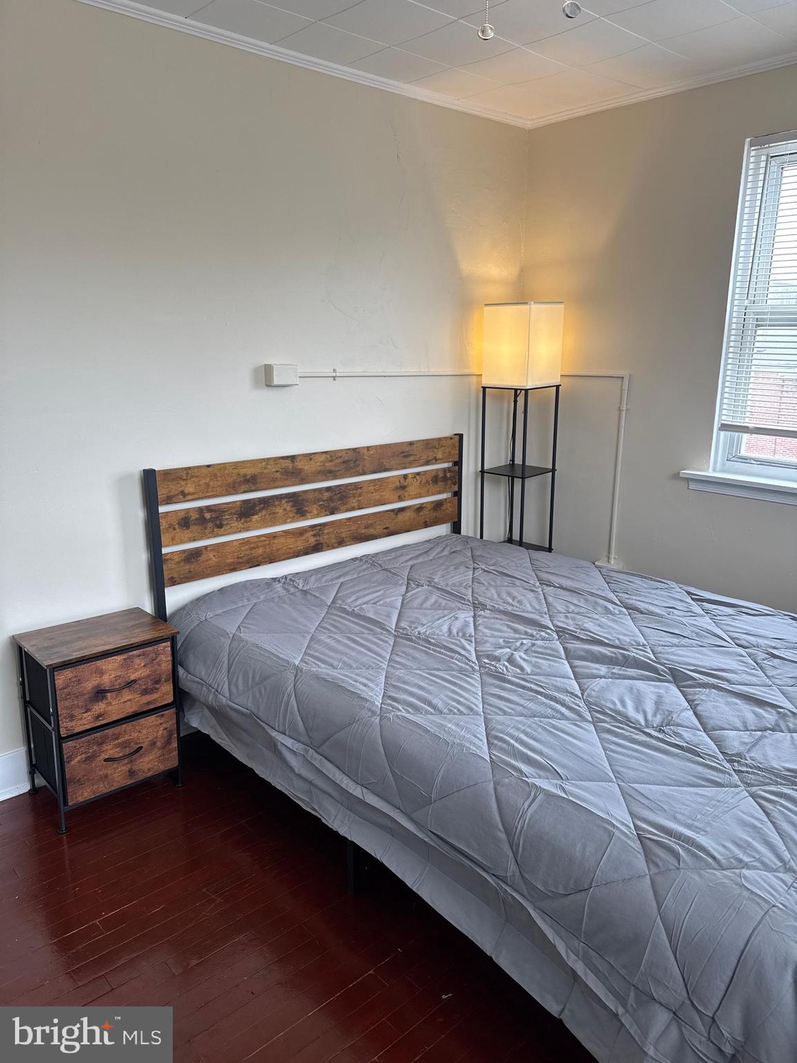 8529 Chestnut Oak Road, Unit 2 Parkville, MD 21234 - Photo 46 of 50 a bedroom with a bed and a window