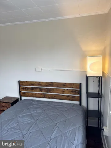 a view of room with a door and a rug