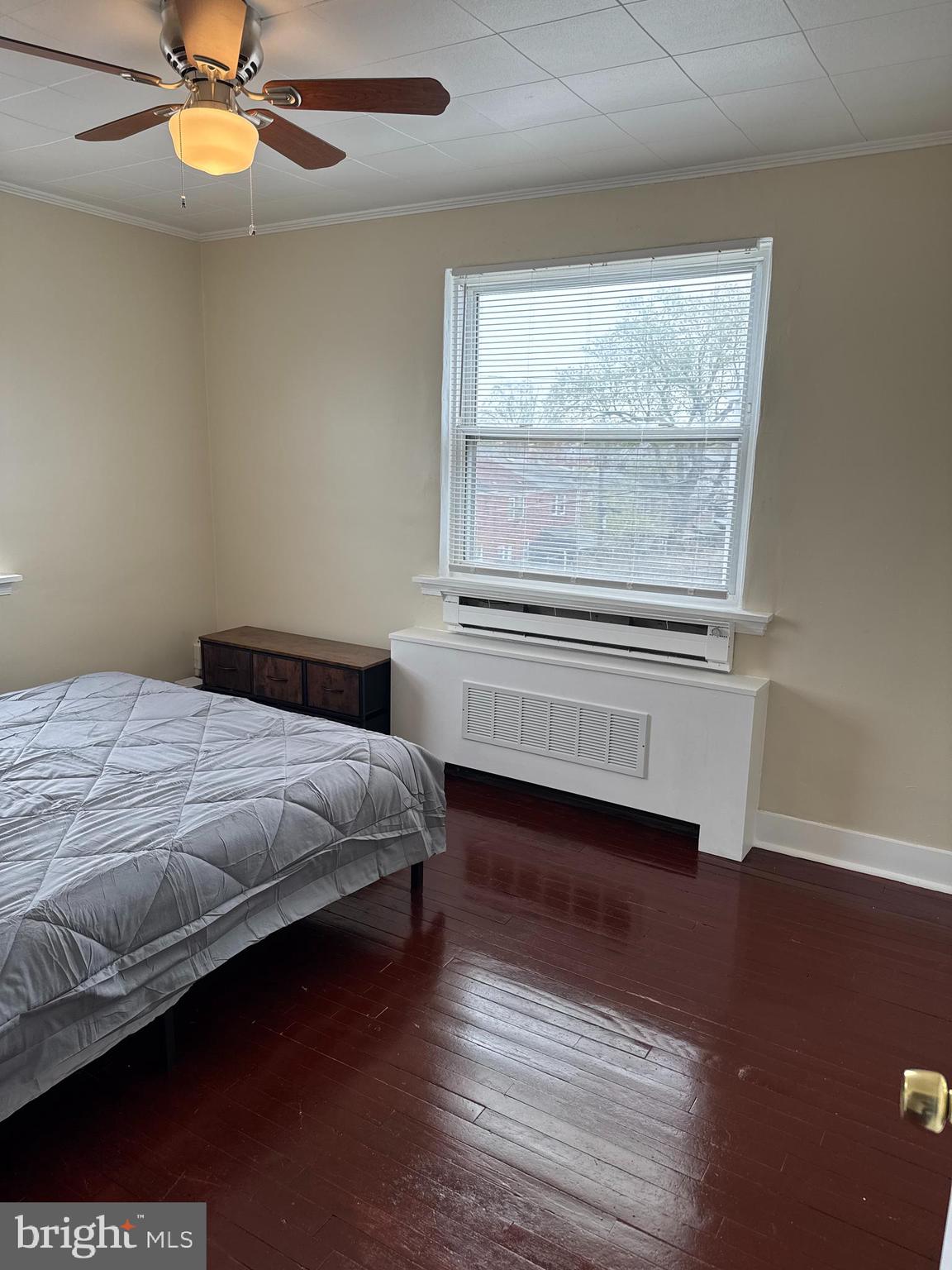 8529 Chestnut Oak Road, Unit 2 Parkville, MD 21234 - Photo 6 of 50 a bedroom with a bed and a window