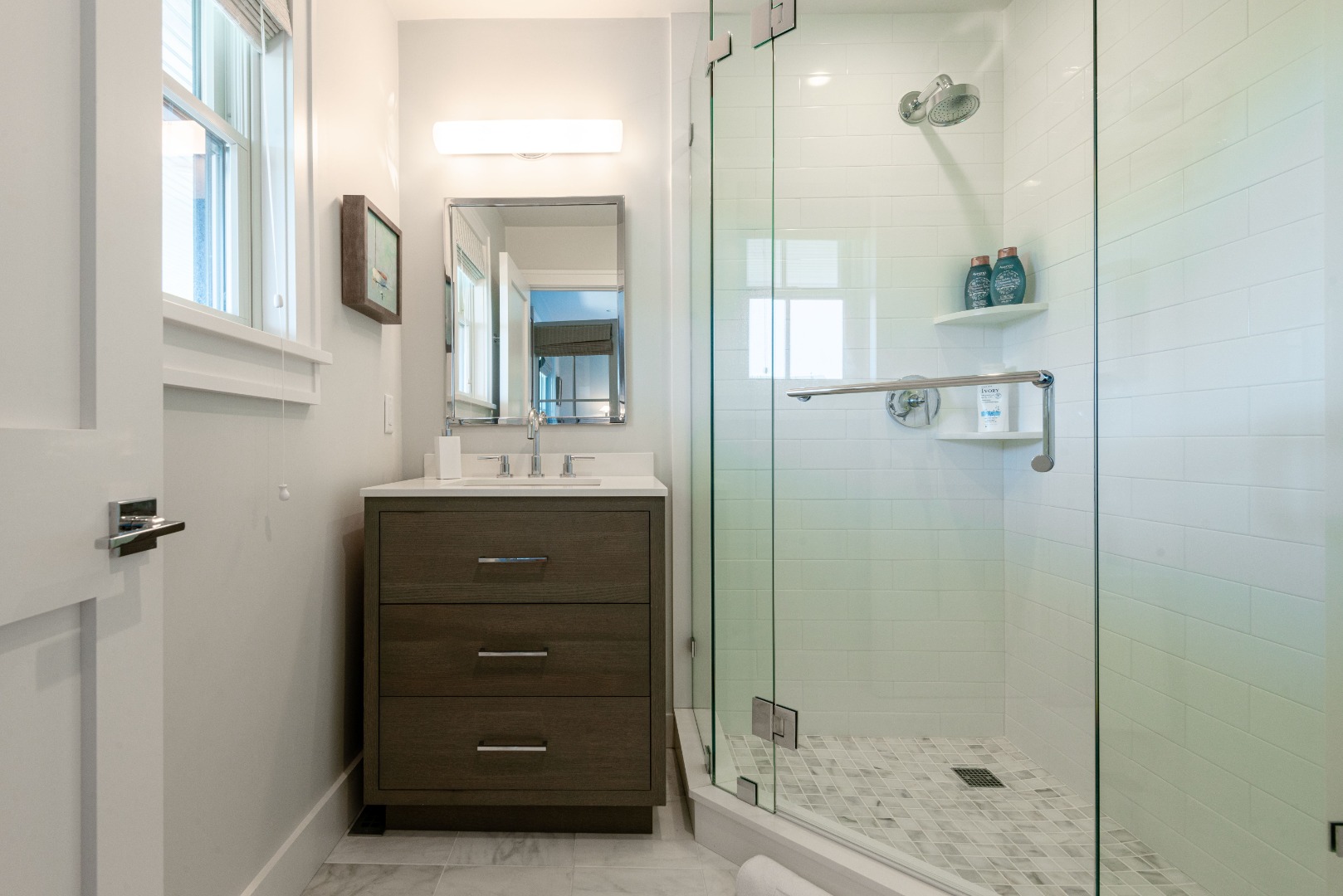 34 Bosworth Road Nantucket, MA 02554 - Photo 31 of 38 a bathroom with a shower a sink and mirror