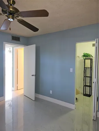 a view of a hallway with a closet
