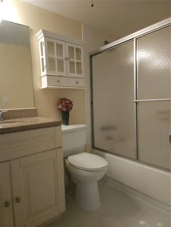 a bathroom with a shower and a toilet